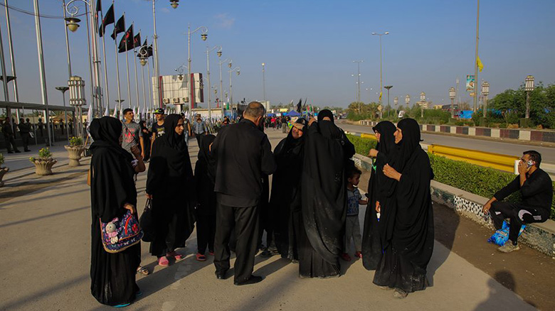  Walking in groups to the holy city of Kerbela.