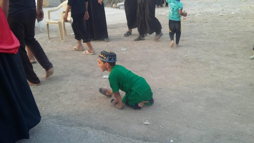 A boy with special needs is heading to the Ziyarat of Imam al-Hussayn (PBUH).