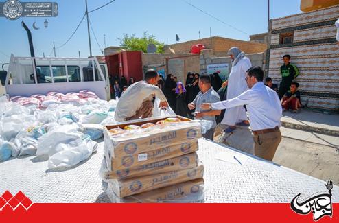 Imam Ali Center for the Care of Orphans and Chaste Families at Imam Ali Holy Shrine distributes food in Al-Haidariyah District.