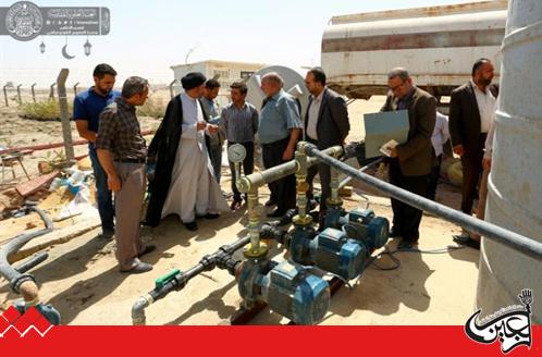 Secretary General of Imam Ali(AS) Holy Shrine supervises the pumping of potable water to the houses of Qanbar Residential Complex in Najaf, Iraq.