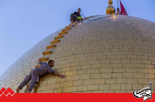 The servants of Aba al-Fadl al-Abbas(PBUH) clean the holy dome.